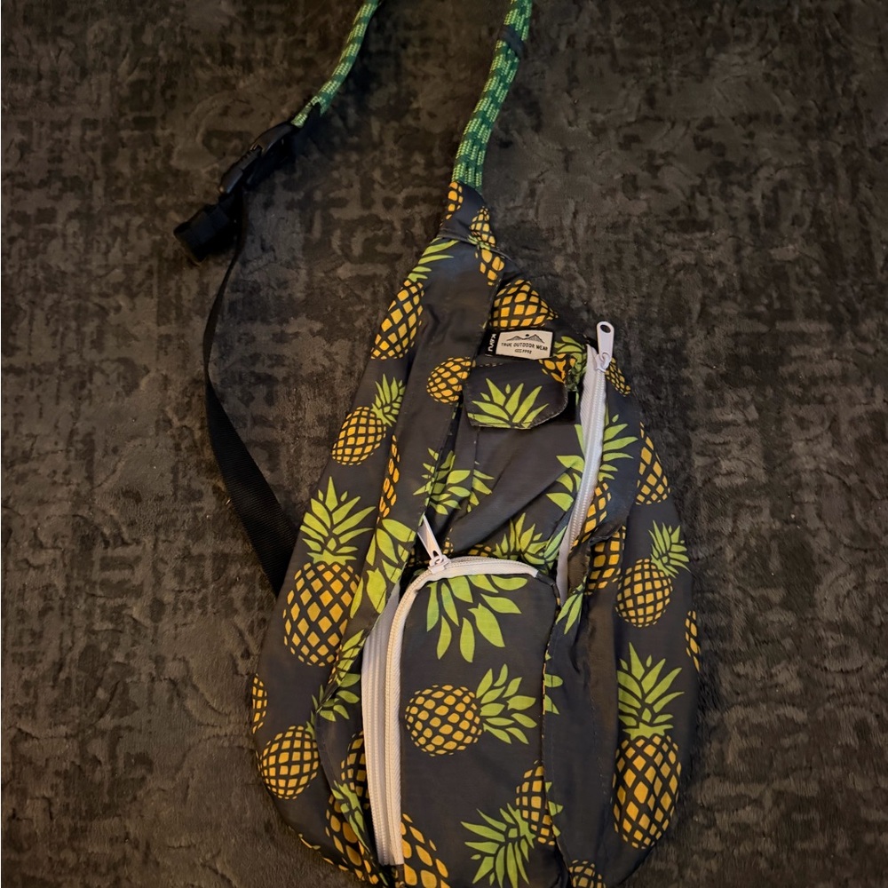 Kavu Pineapple Print Sling Bag in Yellow and Green on Black